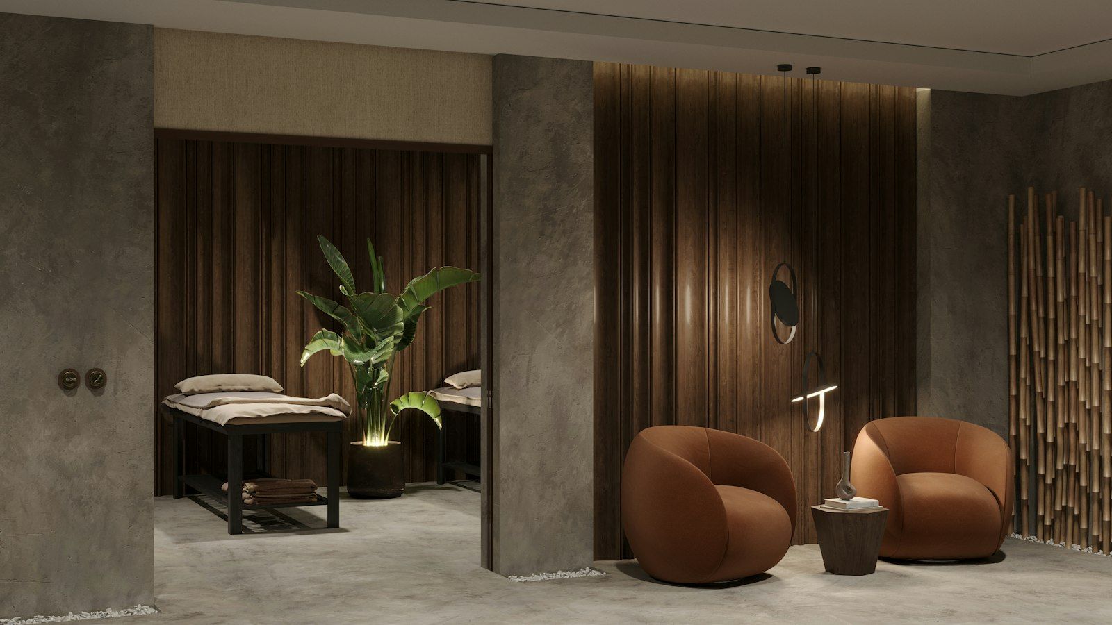 a clinic lounge with two chairs and a plant